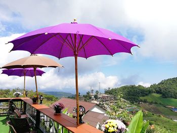Scenic view of parasol against sky