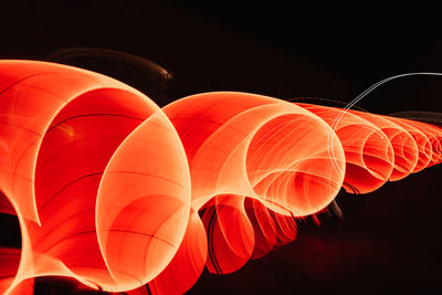 Low angle view of illuminated lanterns at night