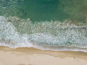 Scenic view of sea waves rushing on shore