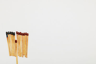 Directly above shot of wooden structure against white background