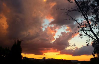 Low angle view of cloudy sky at sunset