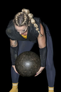 Woman from the basque country practicing stone lifting rural sport