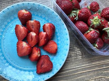 High angle view of strawberries in bowl on table