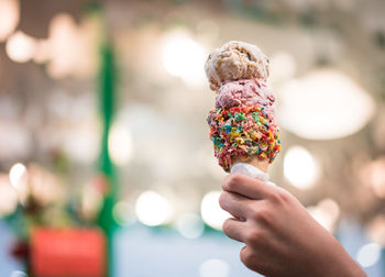 Cropped image of hand holding ice cream