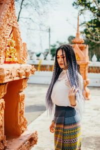 Woman standing in traditional clothing