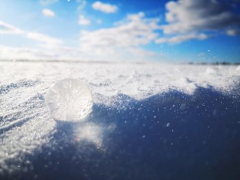 Close-up of ice crystals against sky