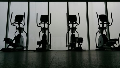 Empty exercise bikes at healthy club
