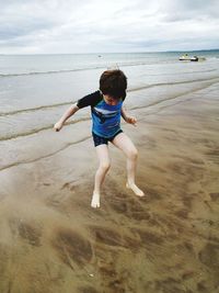 Full length of boy on beach