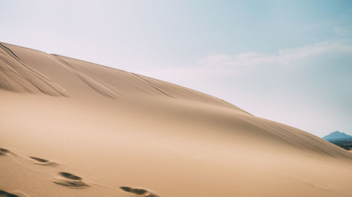 Low angle view of desert against sky