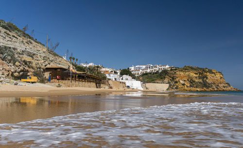 Beach in the fishing village of burgau in the algarve, portugal