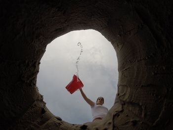 Woman standing against sky