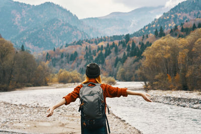 Rear view of man looking at mountains