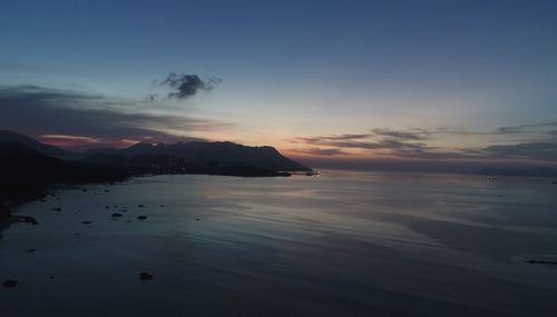 Scenic view of sea against sky at sunset