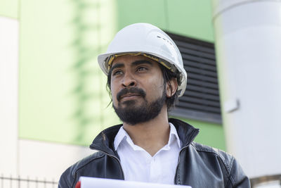 Portrait of young man looking away