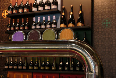 Close-up of wine bottles on rack