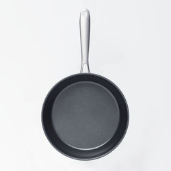 Frying pan top view with white background