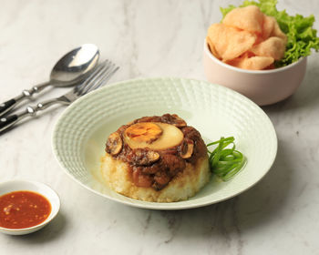 Homemade nasi tim ayam jamur chicken and mushrom steam rice with soy sauce 