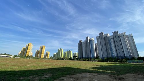 Modern buildings in city against sky