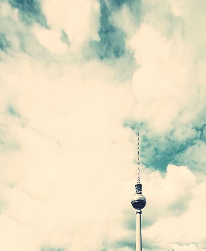 LOW ANGLE VIEW OF TOWER AGAINST CLOUDY SKY