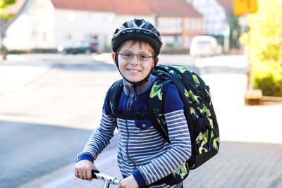 Portrait of boy standing outdoors