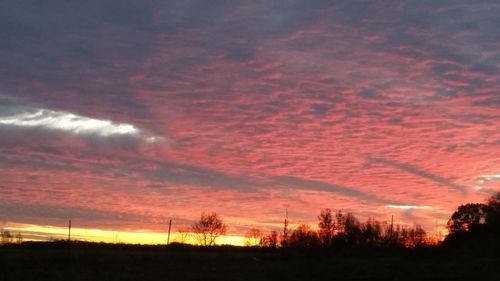 Scenic view of silhouette landscape against sky during sunset