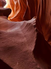 Low section of woman standing on rock formations