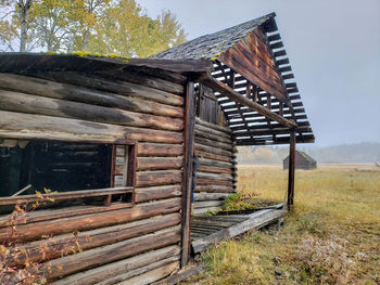 Abandoned built structure on field against sky