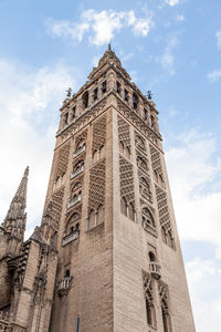 Low angle view of la giralda cathedral against sky