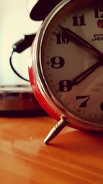 Close-up of clock on table