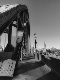 View of bridge and buildings against sky