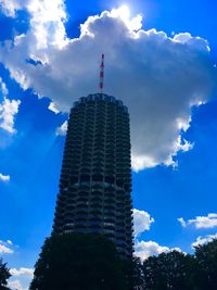 Low angle view of building against cloudy sky