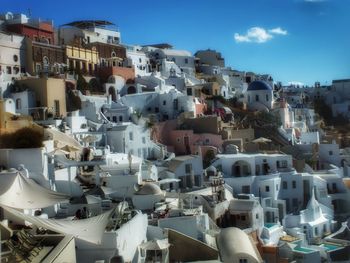 Aerial view of town against blue sky