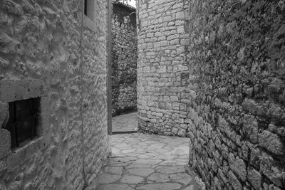 Stone wall of old building in city