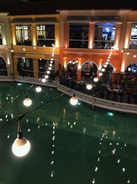 Illuminated lights in water at night