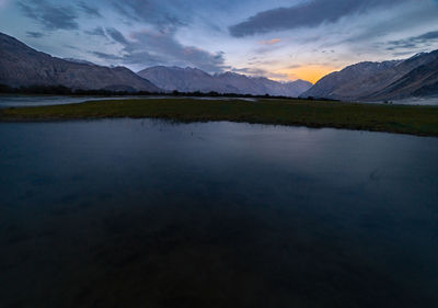 Scenic view of lake against sky during sunset