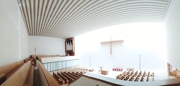 High angle view of empty pews in church