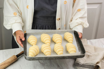 Midsection of man preparing food