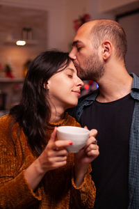 Young couple looking away outdoors