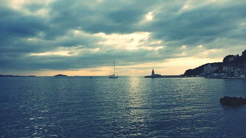 View of calm sea against cloudy sky