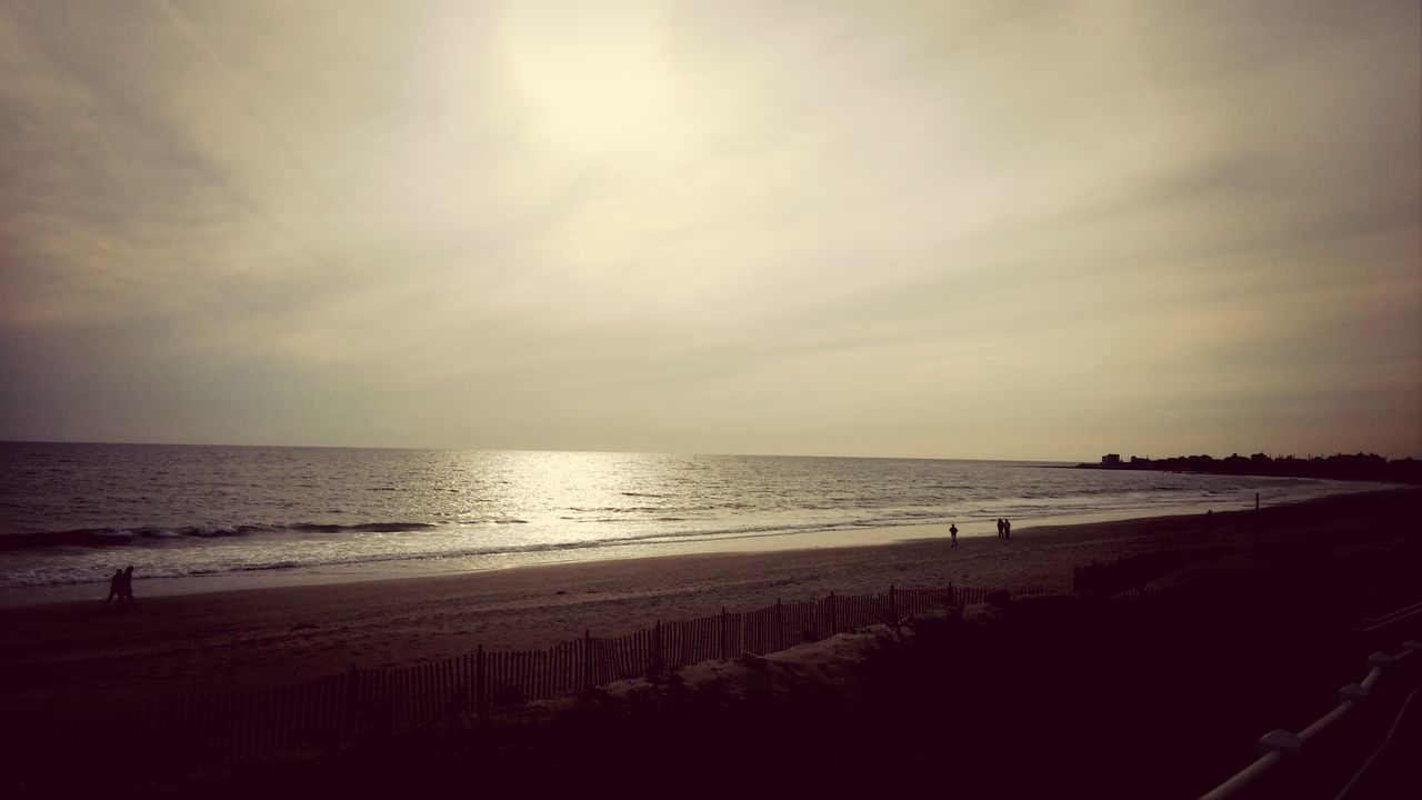 sea, horizon over water, beach, water, shore, scenics, tranquil scene, sky, tranquility, beauty in nature, sunset, sand, nature, idyllic, incidental people, cloud - sky, coastline, sun, sunlight, silhouette