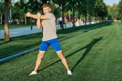 Full length of man standing on grass