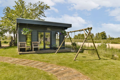 Built structure on field against sky