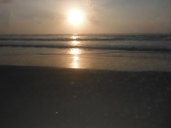 Scenic view of sea against sky at sunset