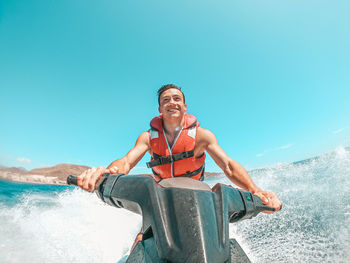 Man jet boating in sea