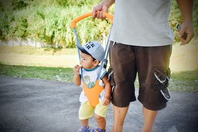 Full length of father and son