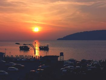 Scenic view of sea against orange sky