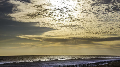 Scenic view of sea against sky at sunset