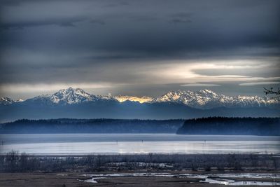 Scenic view of mountains against sky during winter