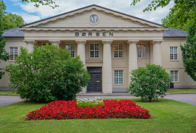 View of plants in front of the oslo stock exchange building