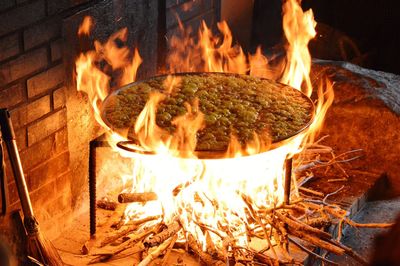 Bonfire on log at night